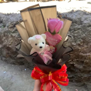 single pink rose bouquet with white teddy bear wrapped in beige wrapper