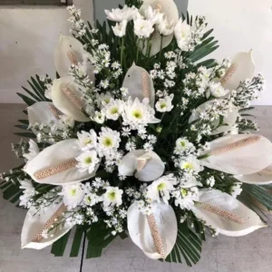 white daisies with white anthuriums flower basket by Floral Creations by Cherry C.